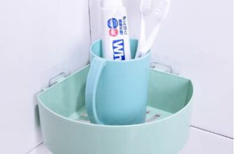Kệ góc nhà tắm dán tường màu xanh đựng đồ vệ sinh